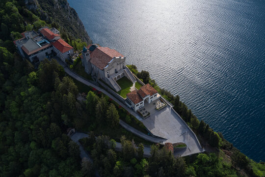 Aerial panorama of Montecastello. Catholic Church Eremo di Montecastello. Aerial view of the church on the mountain. Lake Garda, Italy. Top view of the Eremo di Montecastello church.