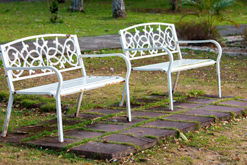 Long old white bench In the park