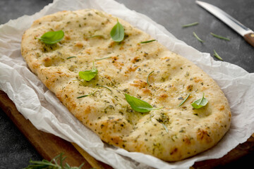 Pita bread close-up. Focaccia bread with rosemary, olive oil.