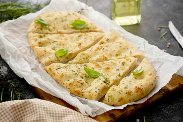 Pita bread close-up. Focaccia bread with rosemary, olive oil.
