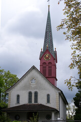 Fototapeta na wymiar Protestant church Zurich Schwamendingen at springtime. Photo taken May 19th, 2021, Zurich, Switzerland.