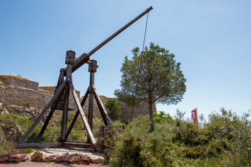 Medieval catapult in the castle of Lorca, Murcia, Spain. Military instrument used in ancient times...