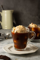 Coffee affogato summer cold drink. Coffee cup with ice cream scoop, dessert.