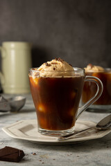Coffee affogato summer cold drink. Coffee cup with ice cream scoop, dessert.