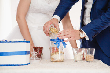 Details of wedding ceremony and tradition of making family amulet from different grain, indoor....