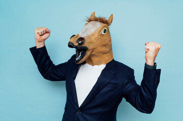 man with happy horse mask