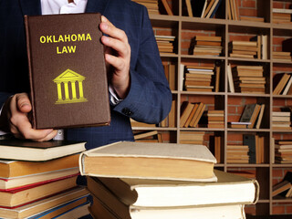 Book with title OKLAHOMA LAW . Oklahoma residents are subject to Oklahoma state and U.S. federal laws