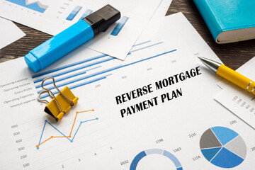 Conceptual photo about Reverse Mortgage Payment Plan with handwritten text.