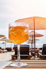 Close-up of crystall glass with orange drink
