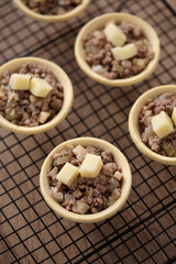 Mini pie from meat and mushrooms in metal tray