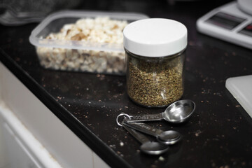 Bottle of oregano and tablespoon