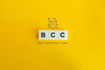 Body Centered Cubic (BCC) Crystal Structure Banner and Concept. Block letters on bright orange...