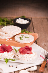 Rice cakes with milk flakes and cold beef.