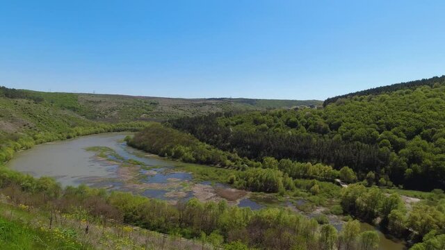 Panoramic, slow-motion view from above on the Ternava river and canyon of national nature park Podilski Tovtry