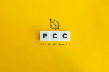 Face Centered Cubic Crystal System and one of three Cubic Bravais Lattices. Block letters on bright...