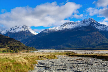 Mountainous landscape in the South Island of New Zealand. The Humboldt Mountains, part of the Southern Alps, with the Dart River in the foreground