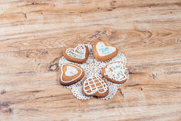 Homemade heart-shaped cookies, decorated with white icing with sprinkles