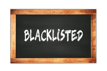 Obraz premium BLACKLISTED text written on wooden frame school blackboard.