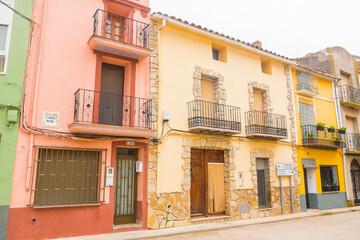 Fototapeta na wymiar Vilanova d'Alcolea, Castellon province, Valencian Community, Spain. Beautiful typical vibrant colorful street in Spain. Traditional architecture.
