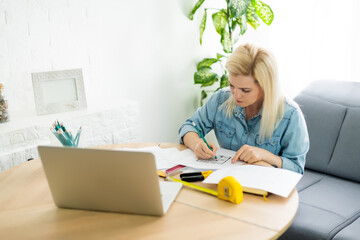 Architect working on blueprint. Architects workplace - architectural project, blueprints, ruler,...