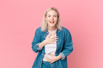 blond pretty woman laughing out loud at some hilarious joke