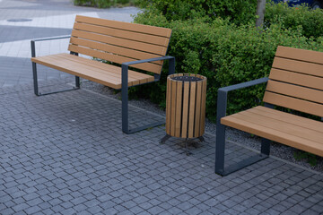 Three wooden litter bins in public area