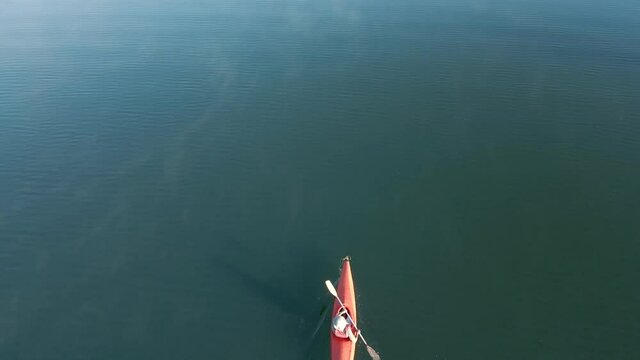 4K Drone footage of young  Indian kayaking in a misty lake in Kotagiri, Nilgiris, Chennai Tamil Nadu, India 60FPS for slow motion