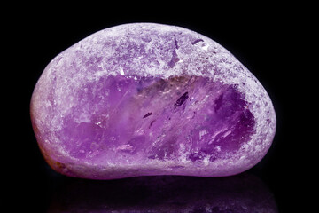 Macro mineral amethyst on a black background