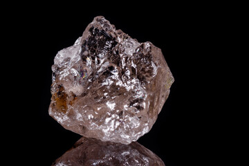 Macro mineral stone smoky quartz Rauch topaz on black background