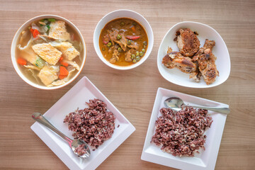 Panang thai red curry with egg soup and asian deep fried chicken eat with steam rice