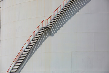 Large white oil tank stairway