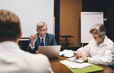 Obraz premium Serious business partners having meeting in office