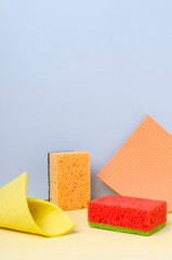Vertical image of sponges for cleaning.Colorful tools for housewark and cleaning.Empty space