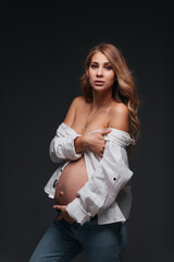 Young beautiful pregnant woman white shirt