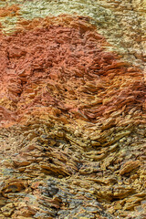 vertical image of a layered rock