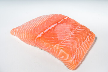 Raw fresh salmon fish steak with spices for cooking, food preparation background top view copy space