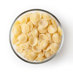 Uncooked orecchiette pasta in glass bowl isolated on white background with clipping path