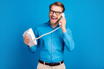 Photo of young man unhappy upset call speak yell phone angry mad problem look empty space isolated...