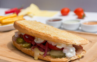 It is a famous Ayvalik Toast Turkish sandwich , it's full of delicious stuffs like cheese, pickle , Russion Salad , Jalapeño Pepper pickle and ofcourse toased bread.