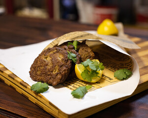 Liver cakes on a cutting board wrapped in white paper