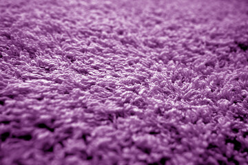 Bath towel texture with blur effect in purple color.