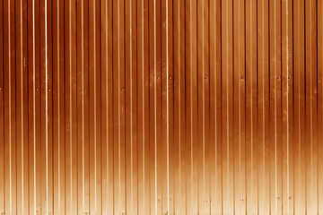 Metal sheet fence texture in orange color.