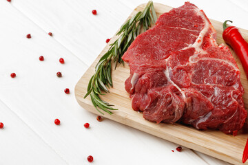 Beef tenderloin on wooden board on wooden table