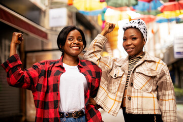 Portrait of a happy smiling female friends. Women laughing and having fun outdoors..