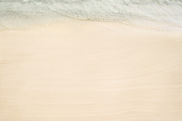 Fototapeta na wymiar Top and aerial view on tropical sand beach with sea. Ocean coastline. Drone photo. Background