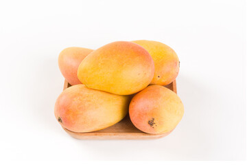 Ripe fresh mango fruit isolated on white background