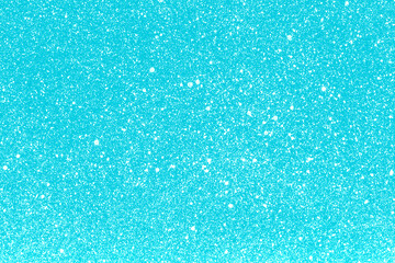 White ink splashes on blue paper. Spray paint grain background. Heaven texture. Blue cloudy sky abstract pattern. Noise backdrop.