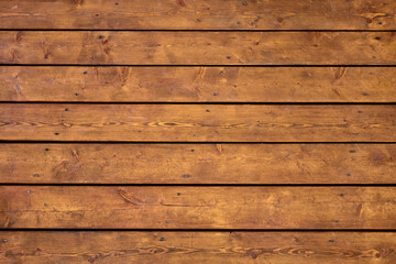 Fototapeta premium Wooden bright brown planks texture with cracks and screws, straight horizontally view