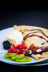 Fresh fruits mix with vanilla ice cream and crepe.