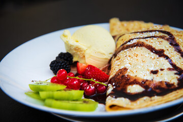 Fresh fruits mix with vanilla ice cream and crepe.